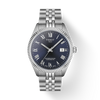 Silver Tissot watch with blue dial on a white background