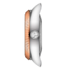 Close-up of a watch with a rose gold and silver band on a white background