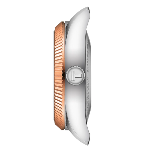 Close-up of a watch with a rose gold and silver band on a white background